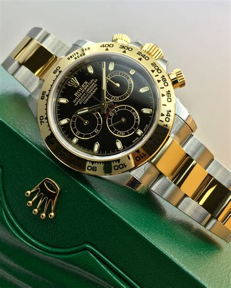 rolex daytona steel gold black dial